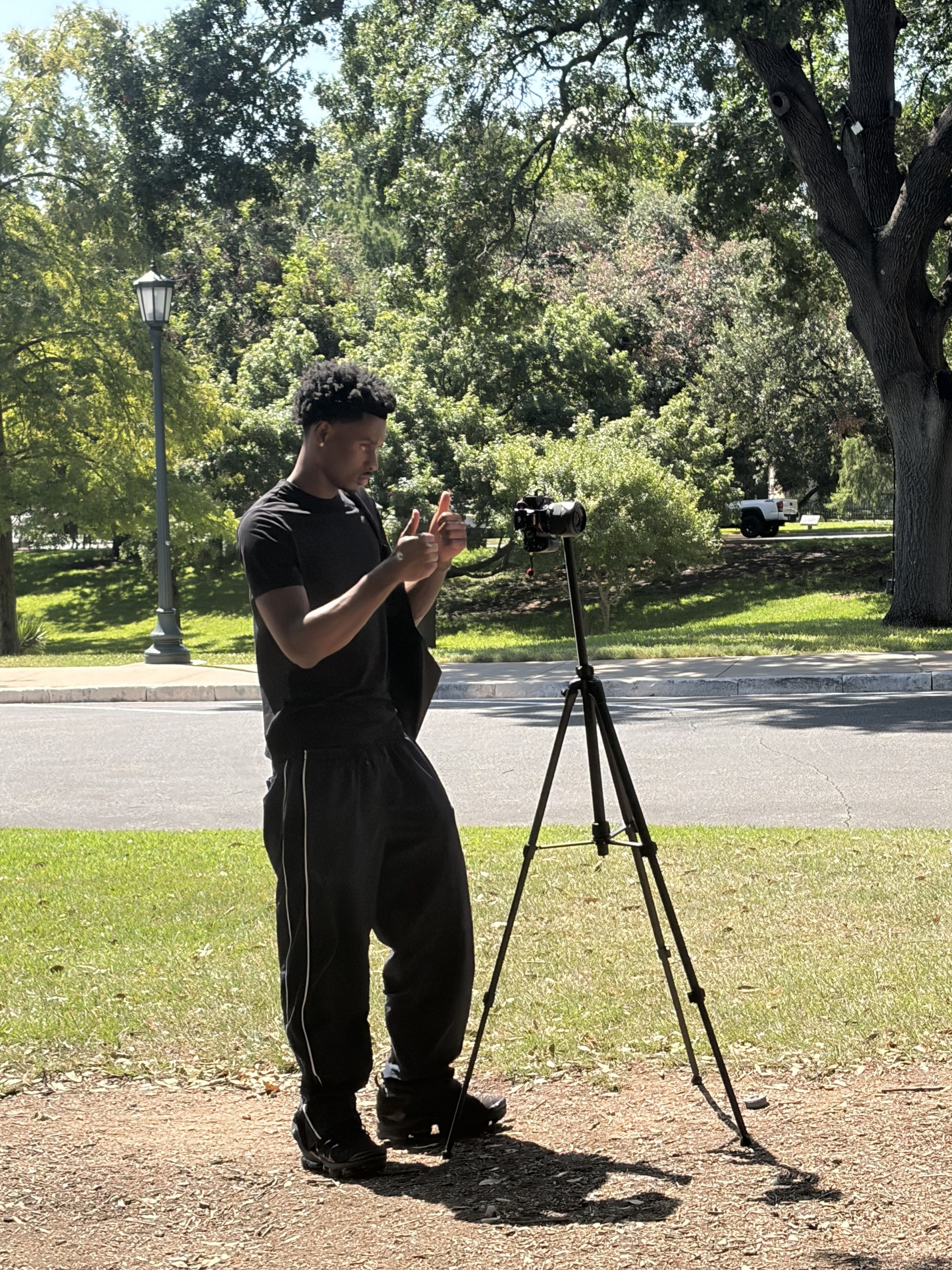 Dom setting up a camera on location
