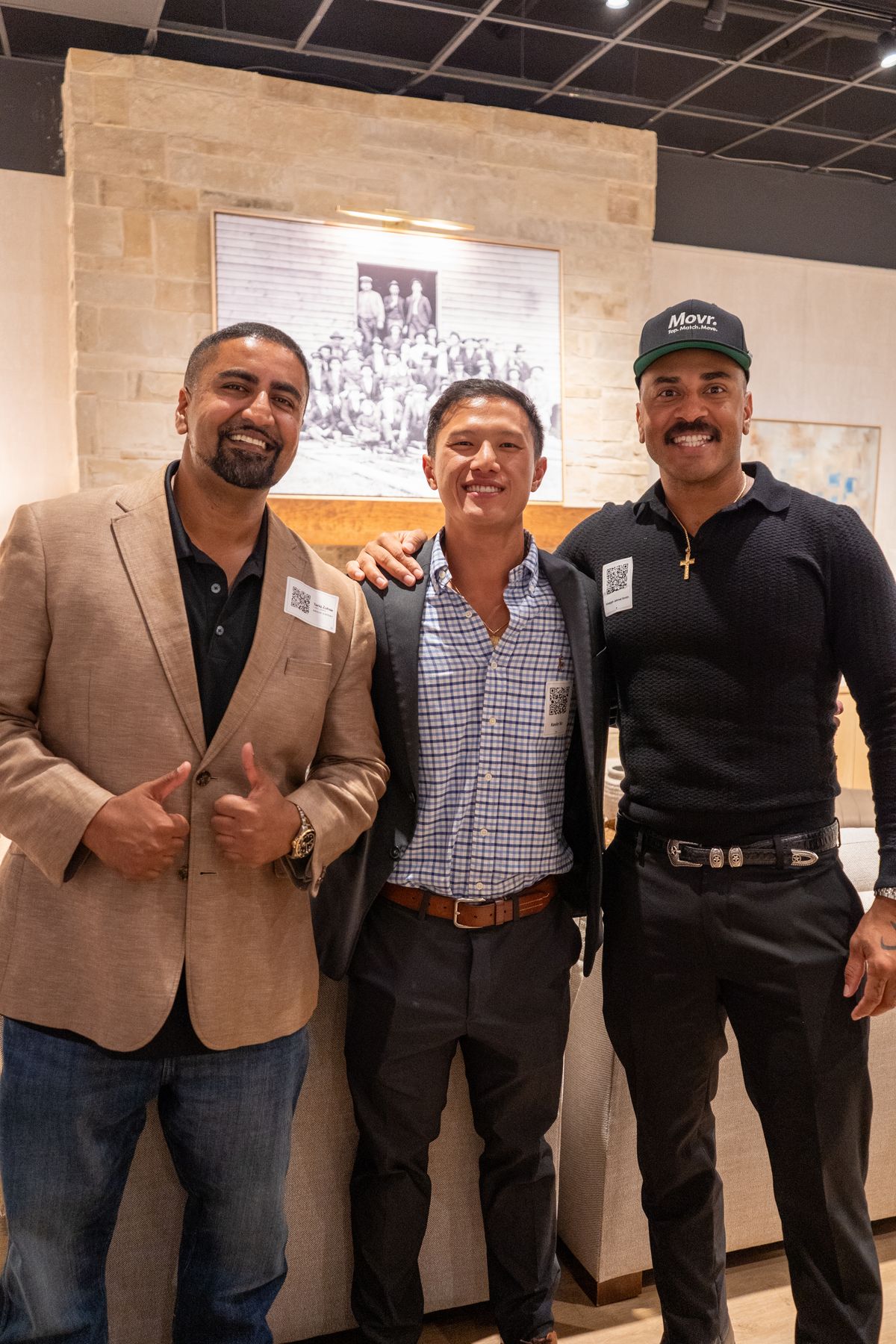 Movr team at a furniture showroom networking mixer, group of three